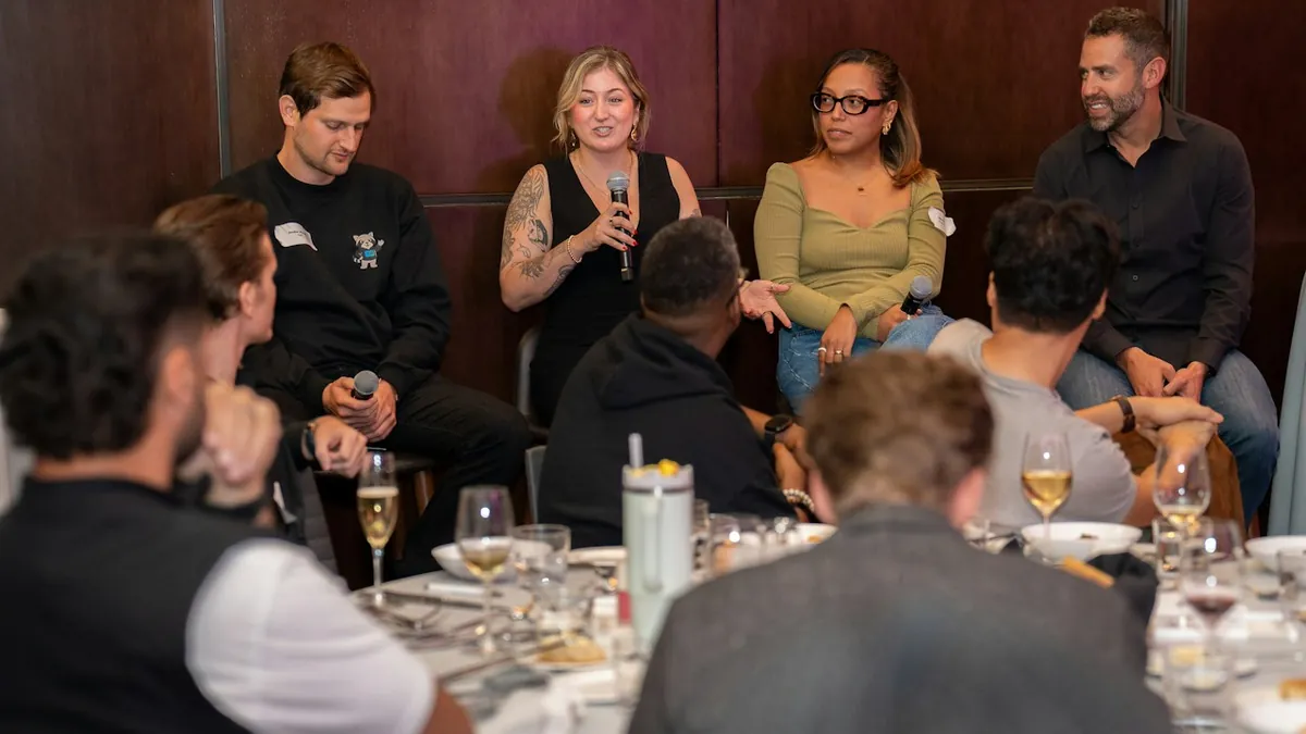 Speakers in conversation during a panel discussion